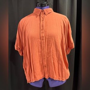 Women's orange collared rolled sleeve button down shirt